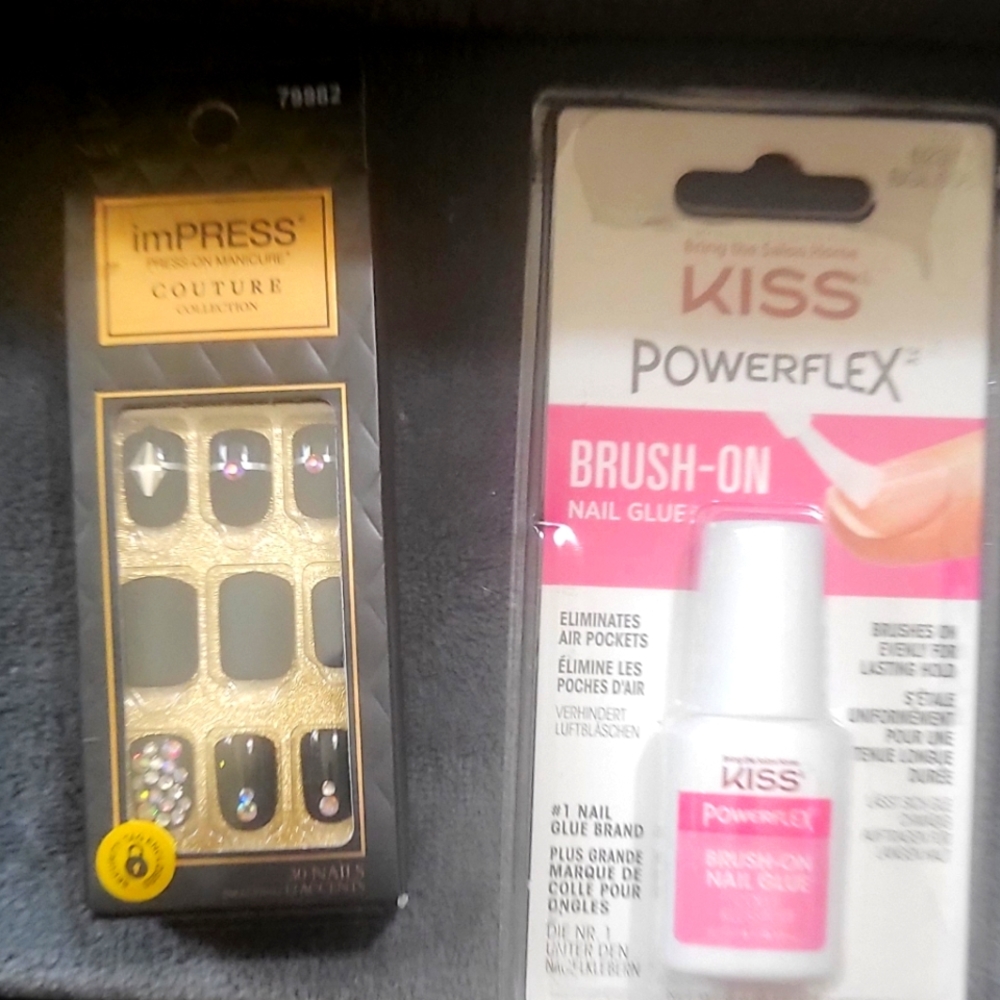 One pack of black impressed nail size small and one pack of glue kiss glue NIB